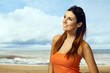 Young woman enjoying summer sun on the beach
