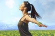 Attractive woman enjoying summer sun outdoors