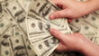 Recount and transfer of money, Lots of hundred dollar bills