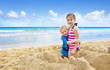 Photo: Children building Sandcastles on the Beach Children building Sandcastles on the Beach