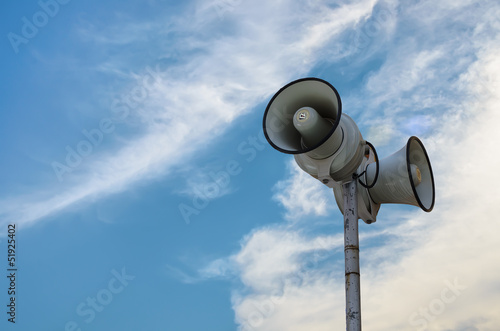 Photo: Loundspeaker with blue sky background Loundspeaker with blue sky background