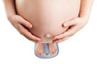 Pregnant woman standing on weight balance