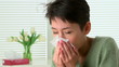 Woman sick with flu sneezing