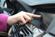 Driver entering an address into the navigation system