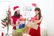 Photo: chinese girl friends during a christmas celebration chinese girl friends during a christmas celebration
