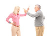An agry female and mature man arguing