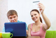 couple buying online with laptop and credit card