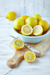 Lemons in a bowl; whole and halved