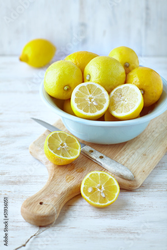 Photo: Lemons in a bowl; whole and halved Lemons in a bowl; whole and halved