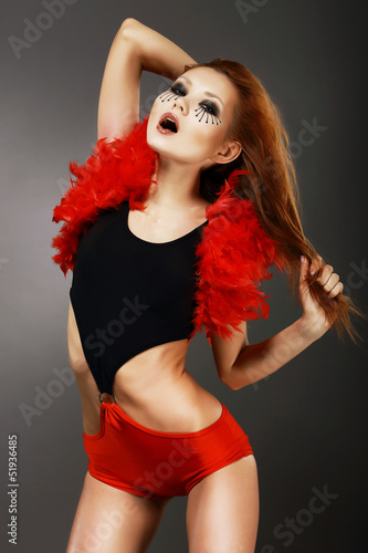 Photo: Showgirl. Red Hair Asian Woman with Fantastic Makeup in Clubwear Showgirl. Red Hair Asian Woman with Fantastic Makeup in Clubwear
