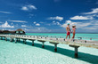 Couple on a beach jetty at Maldives