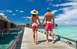 Couple on a beach jetty at Maldives