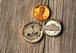 US cent coins over wooden background