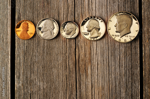 Photo: US cent coins over wooden background US cent coins over wooden background
