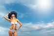 Bikini model over sky background