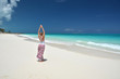 Girl on the desrt beach of Little Exuma, Bahamas