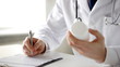 male doctor making a prescription