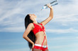 Young female sport girl with a bottle of water