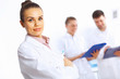 Foto: Young female doctor in white uniform Young female doctor in white uniform