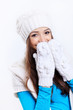 Young woman wearing winter hat and warm scarf