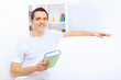Photo: Young man at home with a book Young man at home with a book