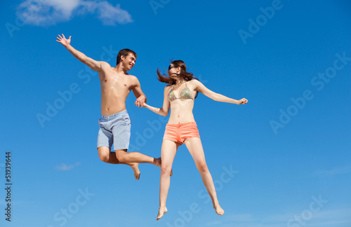 Photo: Happy Young Couple Together On The Beach Happy Young Couple Together On The Beach