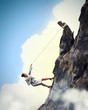 businesswoman climbing mountain