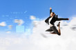 Photo: businesswoman in black suit jumping businesswoman in black suit jumping