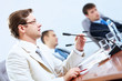 Three businesspeople at meeting