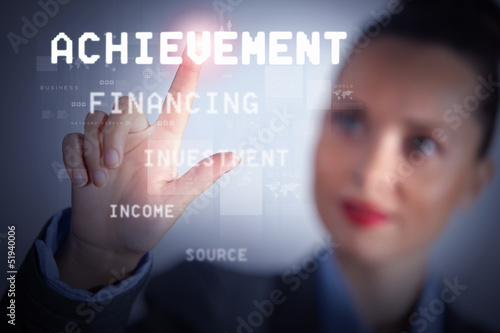 Photo: Business woman touching display Business woman touching display