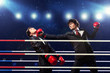 Two young businessman boxing