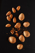 Photo: almond on black background almond on black background