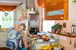 Family - mother making breakfast for school