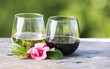 Red and White Wine with Pink Flower outdoors