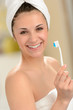 Photo: Fresh girl wrapped in towel brushing teeth Fresh girl wrapped in towel brushing teeth