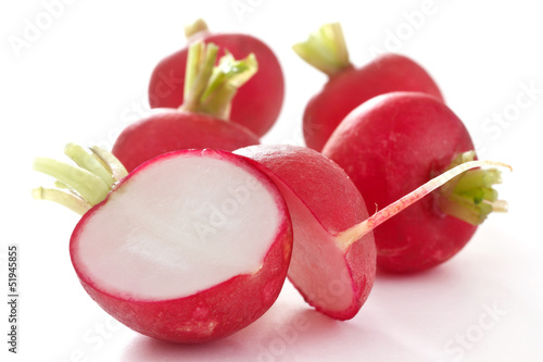 Photo: Red radish cut in half on white Red radish cut in half on white