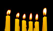 Photo: Burning candles isolated on black background Burning candles isolated on black background