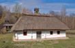 Photo: Ancient traditional ukrainian rural cottage with a straw roof Ancient traditional ukrainian rural cottage with a straw roof
