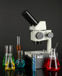 Test tubes with colorful liquids and microscope