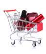 Cosmetics in cart isolated on white