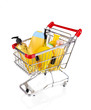 Cosmetics in cart isolated on white