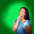 Photo: Pensive woman with a blue money-box Pensive woman with a blue money-box