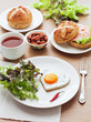 Fried egg on heart-shaped toast with salad for Valentine's Day