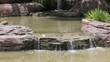 small waterfall at garden in thailand