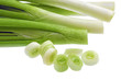 Cutting young onion on white background. Close-Up. Isolated.