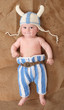 Little viking in handmade knitted costume.