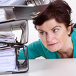 Woman looking at folders on the desk