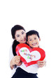 Photo: Asian mother and son holding love card - isolated Asian mother and son holding love card - isolated