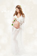 Pregnant woman. Beautiful pregnancy: long curly hair