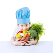 Photo: Boy chef and vegetable isolated on white Boy chef and vegetable isolated on white